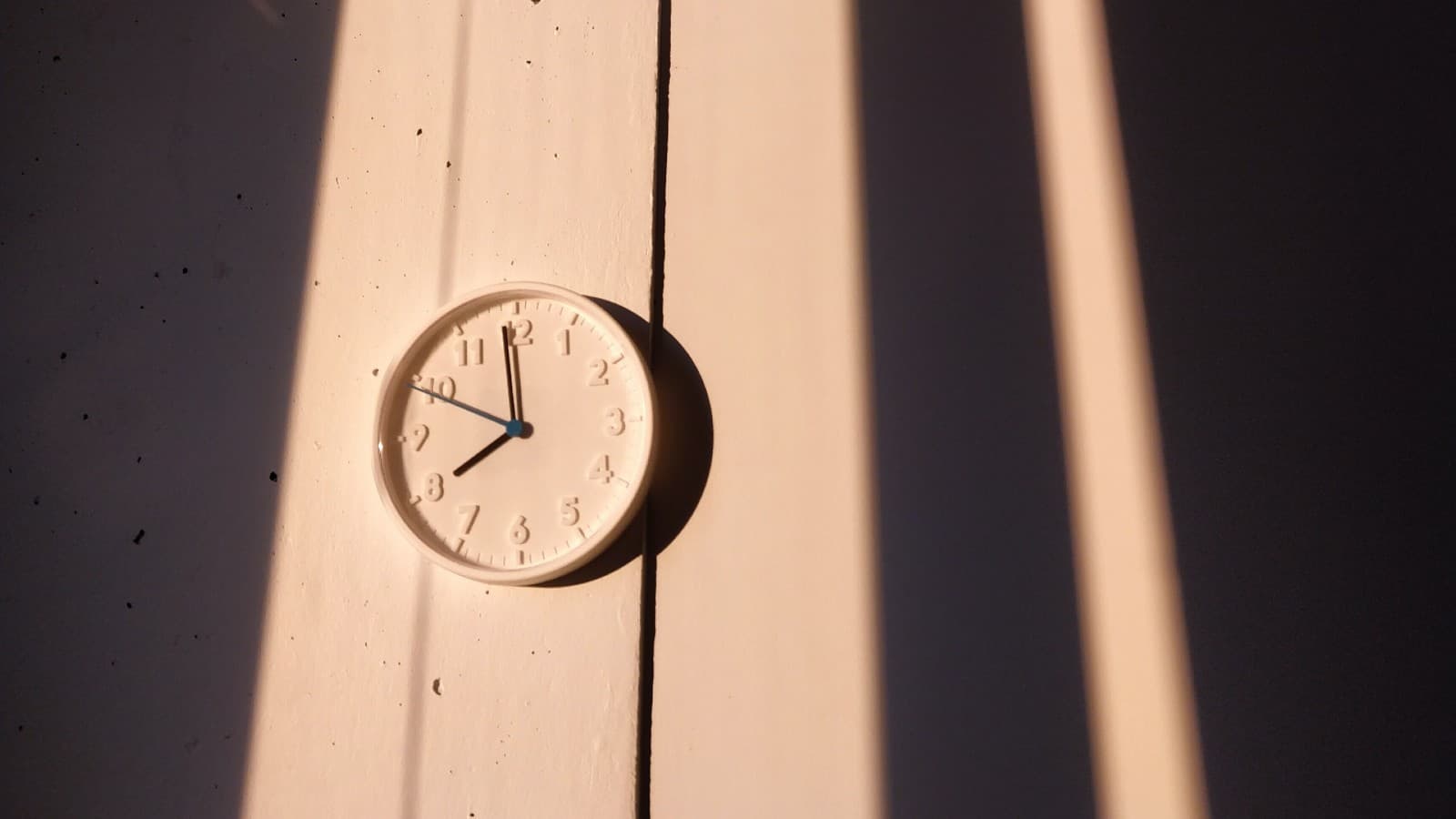Wooden clock on a wooden wall