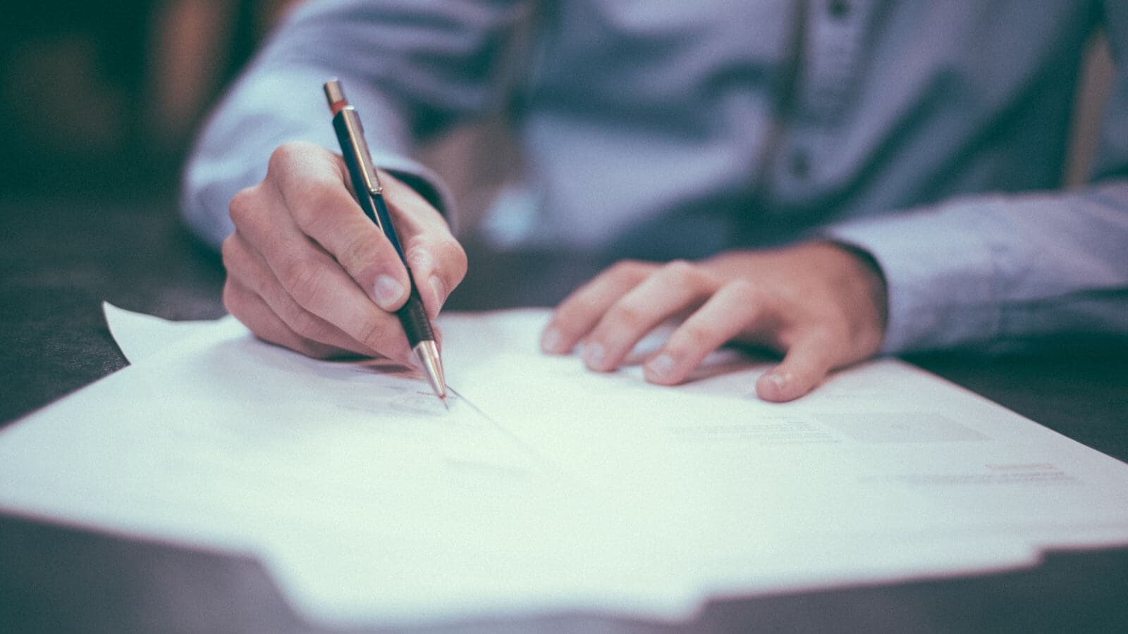 Man writing on papers