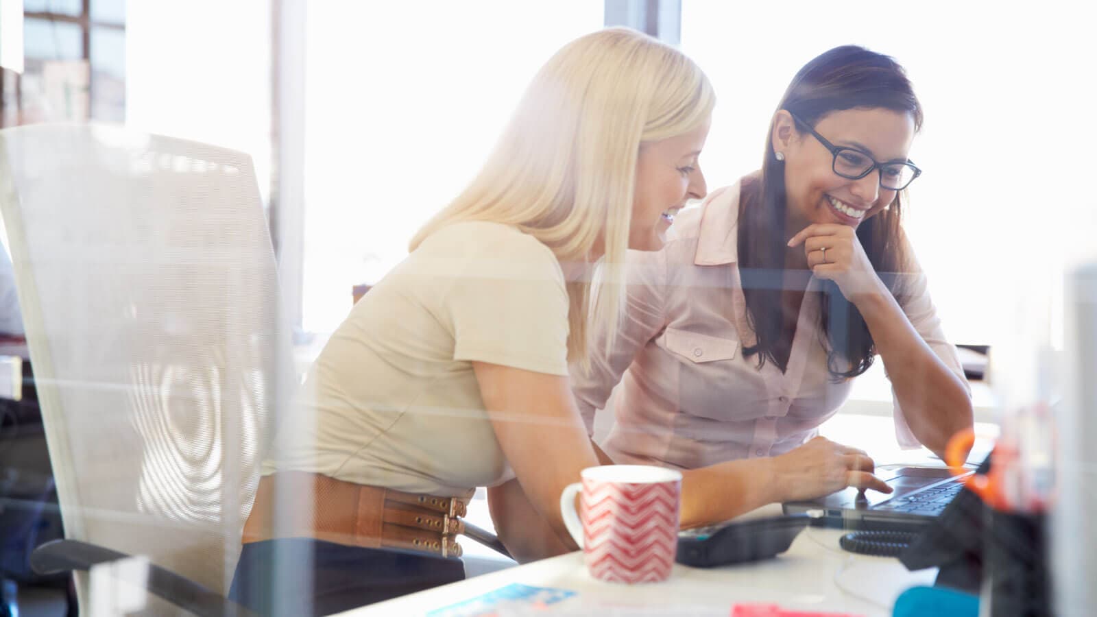 Two women working together